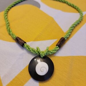 Vibrant Green Beaded Necklace with Unique Cone Shell Pendant